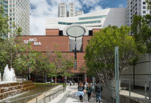 The San Francisco Museum of Modern Art, with the white-clad extension rising behind the original Mario Botta building. Photo © Jon McNeal.